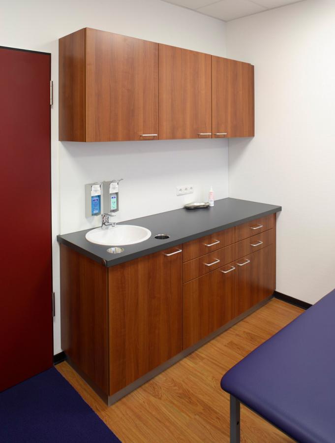 cabinet unit in dark veneered wood in a doctor's surgery