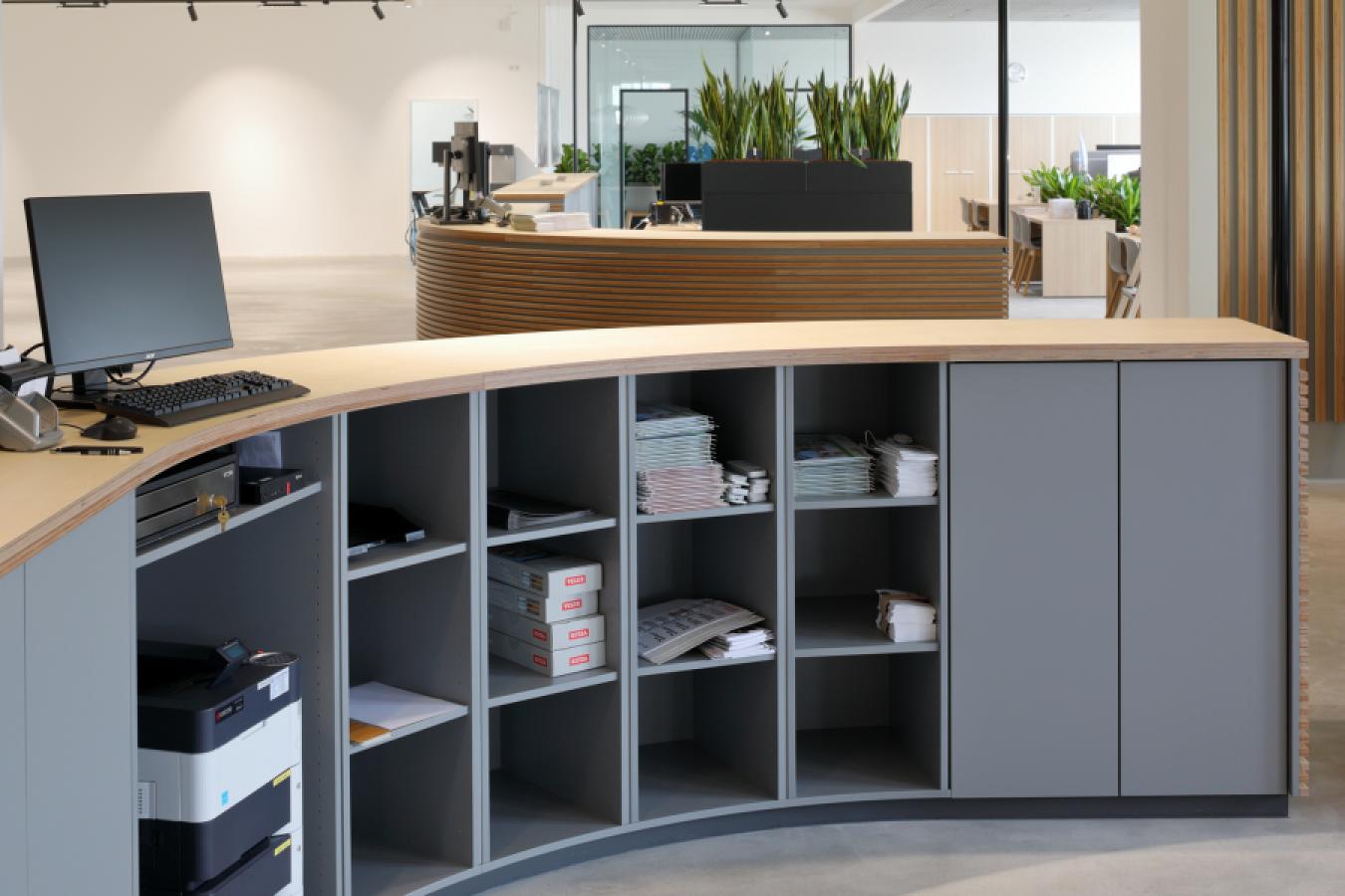 gey curved sideboard with light wooden top